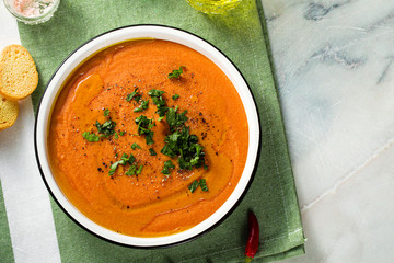 Wall Mural - cream soup of red lentils with tomatoes on the table. healthy vegan warming food for the whole family