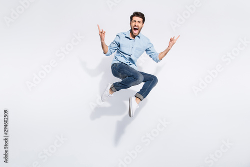 Cuadros en Lienzo Full length photo of wild indian guy jumping high at hard rock concert making fi