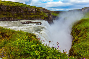 Canvas Print - Water foam and fog up over falls