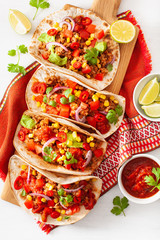 Wall Mural - mexican beef and pork tacos with salsa, guacamole and vegetables