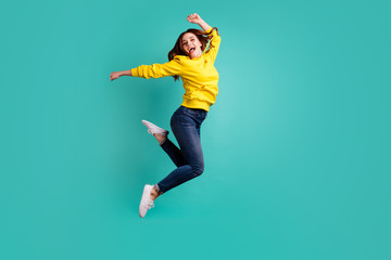 Wall Mural - Full length body size photo of cheerful cute funky attractive gorgeous youngster wearing jeans denim excited ecstatic in footwear isolated over teal vivid color background