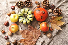 Autumn Flat Lay Background. Pumpkins, Apples, Nuts,leaves, Cups And Sweater On Wooden Background.