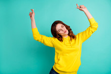 Photo Of Trendy Stylish Cheerful Cute Nice Charming Clubbing Teen Inspired Dancing With Eyes Closed In Yellow Sweater Isolated Over Teal Color Vivid Background