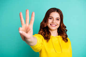 Photo of wavy curly charming fascinating gorgeous girlfriend smiling toothily showing you three fingers sign isolated over turquoise vivid color background