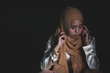 © rachaphak - Young Muslim women sitting and feeling pain.. Lonely Muslim girl harly thinking how to solve life problem.