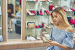 © Aleksandr - woman choosing shoes in the shop