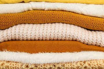 Wall Mural - Background of folded colorful sweaters