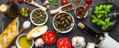 Fotomural Ingredients for mediterranean food on black background