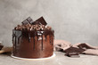 © New Africa - Freshly made delicious chocolate cake on marble table against grey background. Space for text