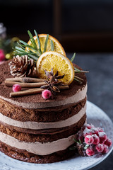  Christmas cake with citrus on a white dishes with green