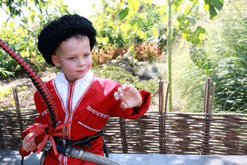 Wall Mural - Child in Cossack clothes with whip