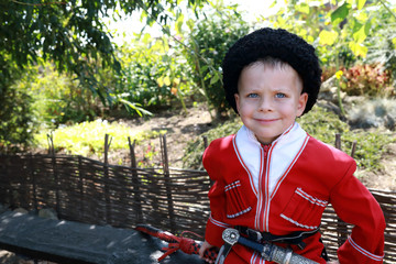 Wall Mural - Kid in traditional Cossack clothes