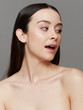 © leandro crespi/Stocksy - Smiling woman beauty closeup
