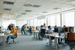 © Lumina/Stocksy - Businesspeople Working at Open Space Office