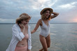 © ZHPH Production/Stocksy - Affectionate female friends having fun on the beach