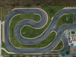© guille Faingold/Stocksy - Paved roadway of small racing track
