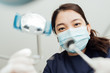 © MaaHoo Studio/Stocksy - Personal perspective of female dentist with mask at work