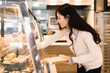 © MaaHoo Studio/Stocksy - Young girl choosing bakery products