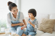 © Maki Company Limited/Stocksy - Cute little girl and her beautiful mother at home.