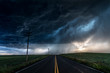 © Cavan Images - Heavy storm and rain with road and green fields