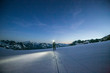 © Cavan Images - An alpinist uses a headlamp to navigate glaciated terrain pre dawn
