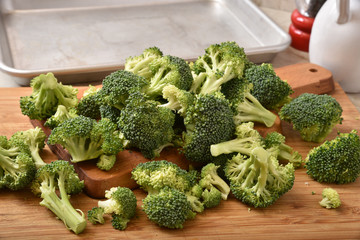 Wall Mural - Broccoli florets on a cutting board