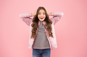 Wall Mural - Whoa. Autumn surprise. Surprised kid on pink background. Surprised child in fashion autumn style. Small girl wear long brunette hair with surprised look. Surprised and shocked