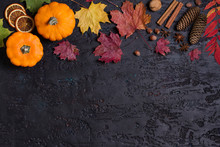 Autumn Leaves, Pumpkin, Pine Cones And Nuts On Black Background With Copy Space. Thanksgiving Concept. Flat Lay, Layout, Room For Text