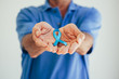 © kleberpicui - Prostate Cancer Awareness. Man with light Blue Ribbon for supporting people living and illness. Men Healthcare and World cancer day concept