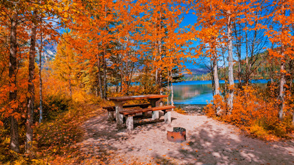 Lakeside Picnic Area In Autumn With Colorful Fall Leaves