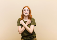 Young Red Head Pretty Woman Smiling Cheerfully And Celebrating, With Fists Clenched And Arms Crossed, Feeling Happy And Positive