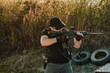 © bnenin - Armed guy shooting with rifle.