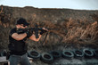 © bnenin - Special force member shooting with sniper rifle.