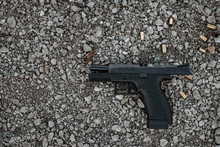 Top View Of A Gun On The Ground.