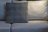 Fototapeta Do akwarium - Modern gray fabric pillow and checkered pattern on the cushion gray sofa interior decoration