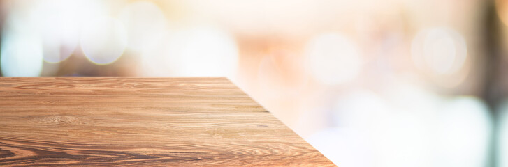 wood table top product display background with blur department store.left perspective wooden reception counter with consumer walk in hallway.Banner mockup presentation for product