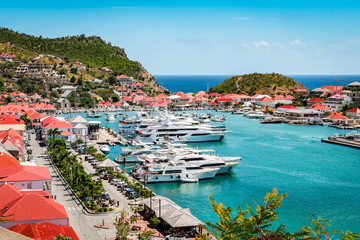 Fototapete - Gustavia, St Barts. Luxury yachts in harbor, West Indies, Caribbean.