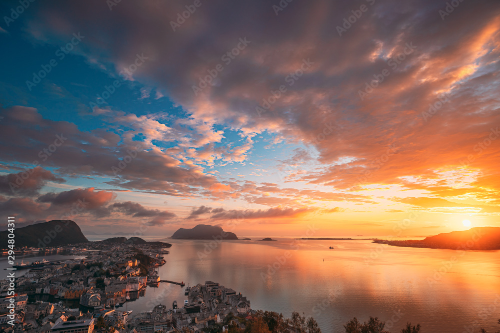 Alesund, Norway. Amazing Natural Bright Sunset Dramatic Sky In Warm Colours Above Alesund Islands. Famous Norwegian Landmark And Popular Destination. Top View - obrazy, fototapety, plakaty 