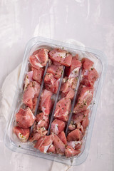 Wall Mural - raw meat of turkey with herbs in plastic box