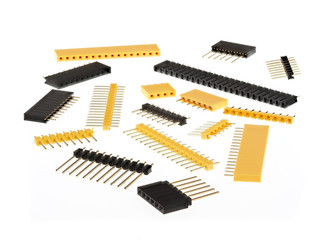 macro shot of a group of 2.54mm single row female and male pin header connectors, isolated on white