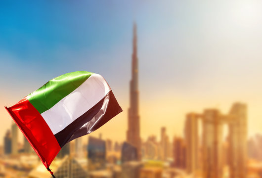 Wall Mural -  - Amazing Dubai skyline cityscape with modern skyscrapers and UAE flag. Downtown of Dubai at sunny day, United Arab Emirates.