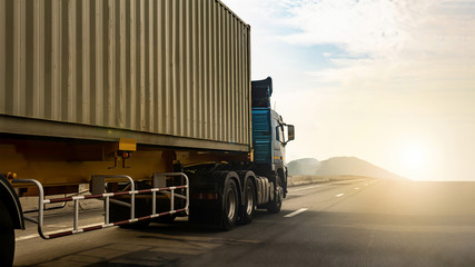 Cargo Truck on highway road with container, transportation concept.,import,export logistic industrial Transporting Land transport on the expressway againt sunrise sky