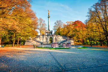 Wall Mural - Splendid autumn view of Angel of Peace (Friedensengel) monument, park statue of a golden angel on a column is a monument to peace with mosaics and a viewing deck, Munich, Bavaria, Germany, Europe.