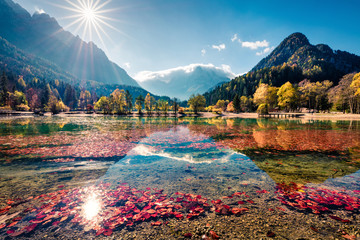 Unbelievable morning view of Jasna lake. Bright autumn scene of Julian Alps, Gozd Martuljek location, Slovenia, Europe. Wonderful landscape of Triglav National Park. Traveling concept background.