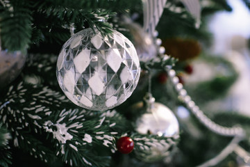 Wall Mural - Christmas tree branch decorated with silver balls and white decor