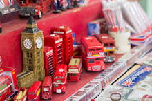 Different Typical Souvenirs Of England Exhibited In A Market Stall