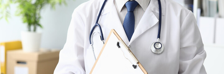 Doctor holding medical clipboard