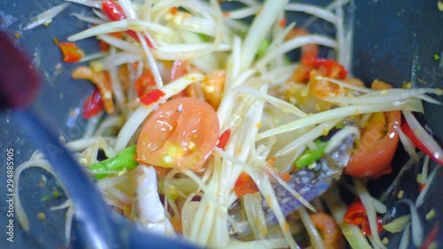 Making Of Green Papaya Salad With Ingredients Crab Dried Shrimp Are Mixing And Pounding In A