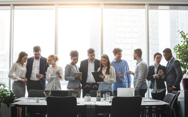 Poster - Diverse business team discussing work during break