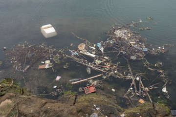 Pollution in the ocean, bottles, polystyrene, plastic bags, etc.